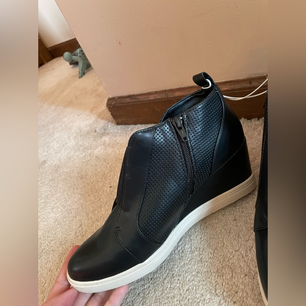 Brand new size 10. Black high heel tennis shoe boots! No tag but still tied